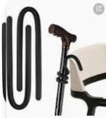 A picture of a walking stick hung over the back of a chair using a pipecleaner wrapped around the stick.